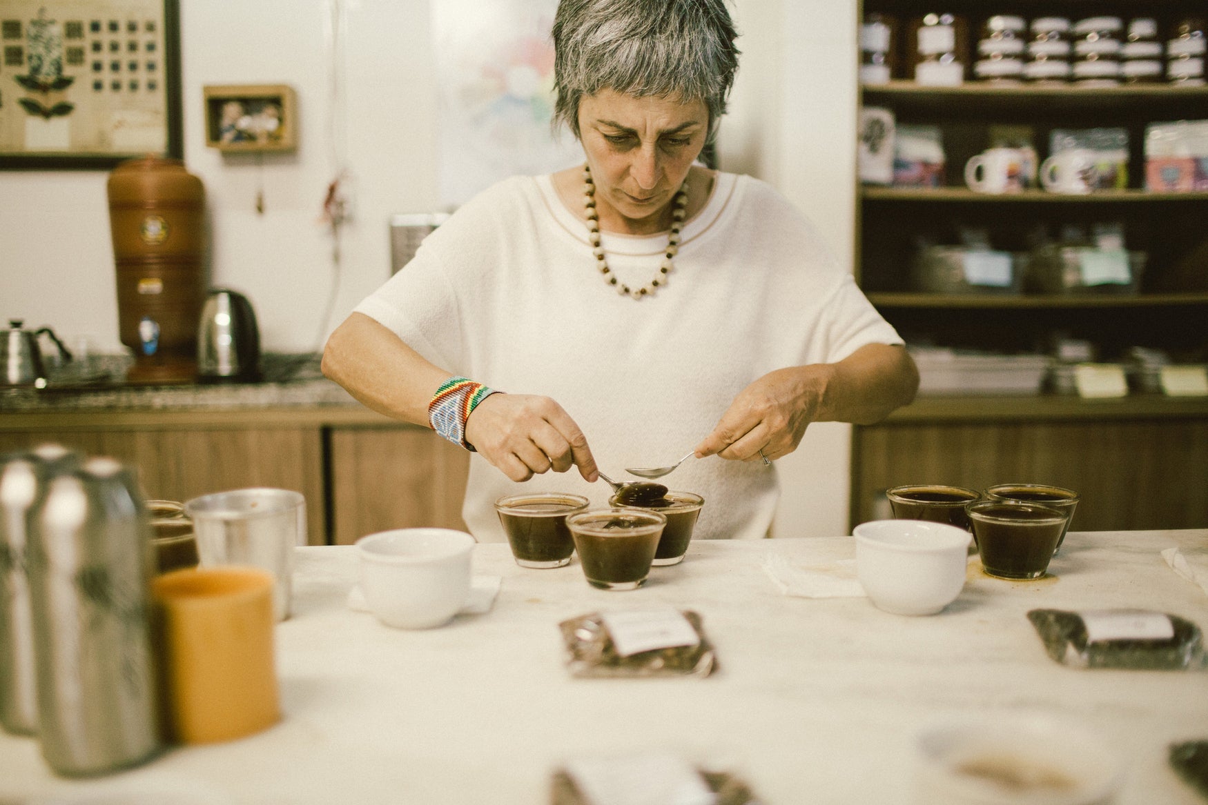 Miriam Aguilar cupping.  Photo credit:  Joyce Yong - Coffee Coalition for Racial Equity