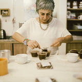 Miriam Aguilar cupping.  Photo credit:  Joyce Yong - Coffee Coalition for Racial Equity