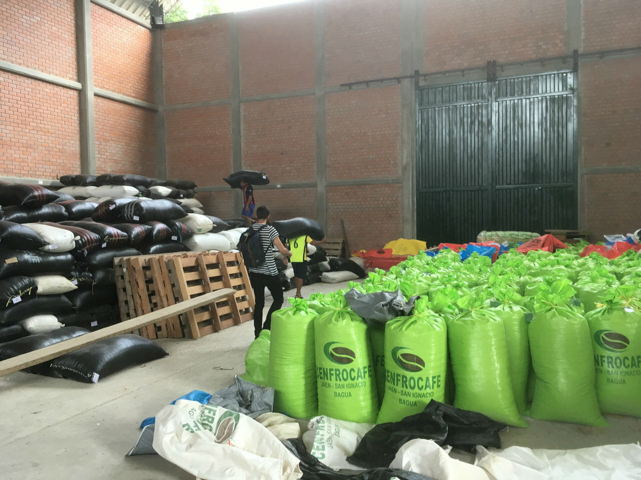Visiting one of the receiving stations of CENFROCAFE around Jaen, Peru.  Coffee is brought to the station in parchment, sorted & graded.  The highest grade, APU(which is what we carry), is stored in green sacks.  